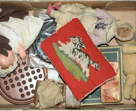 A Victorian woolwork miniature cushion of a running dog, an early 20th c painted felt doll in the form of a woman with padded