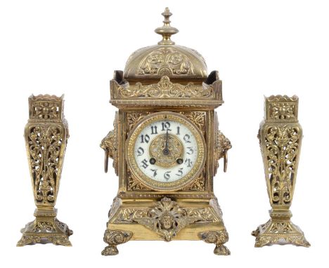 A French cast brass clock, late 19th c, the pillar shaped case with primrose enamel chapter ring surmounted by a galleried do