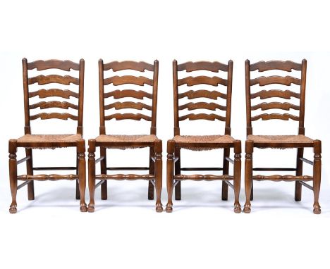 A set of four stained ash ladder back chairs, 19th c style, rush seated, seat height 45cm  Handling wear to rails