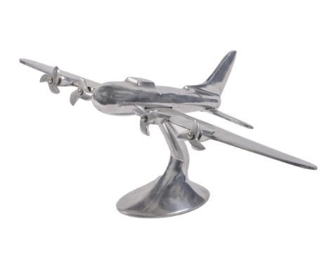 A cast aluminium model of a stylised four-engine turbo-prop aeroplane, wingspan 55cm  Good condition