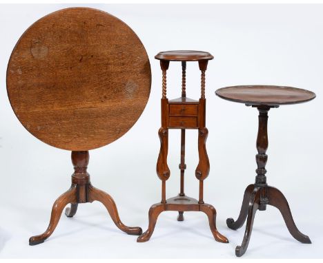 An oak tripod table, 19th c, 70cm h; 66cm diam, another tripod table and a mahogany wig stand (3)  Smaller table - top repair