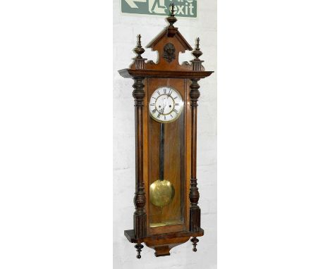 A walnut Vienna clock, early 20th c, pendulum and two brass sleeved weights, approximately 132cm h  Dusty / dirty, enamel dia