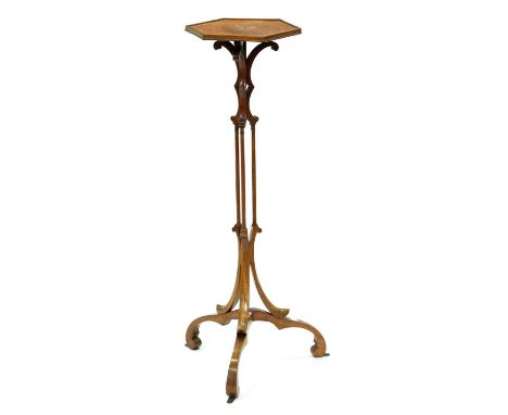 A mahogany torchere, 19th c,&nbsp;based on a design by Thomas Chippendale [Director, 1754, plt CXX], the hexagonal top on tri