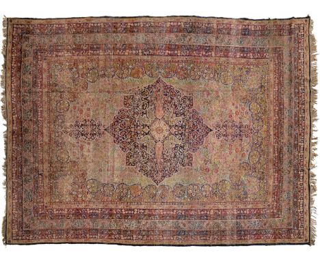 A Persian design medallion carpet, 492 x 352cm  Worn