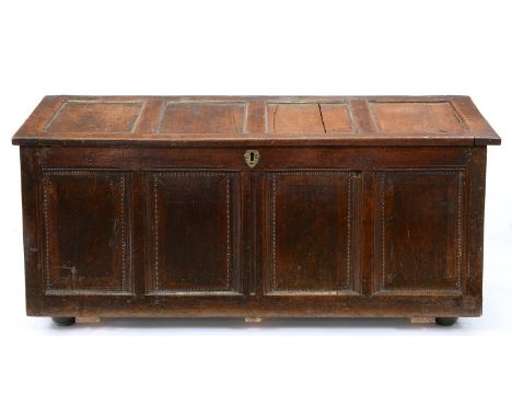 A panelled oak chest, first half 18th c, 61cm h; 55 x 136cm  Splits and other damage and repair