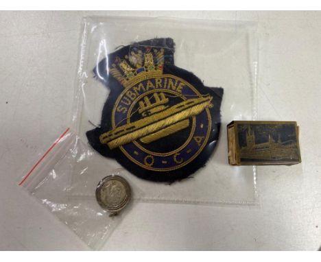 A submarine sew on patch together with a vintage French hotel matchbook and a Georgian Buckingham Palace medallion