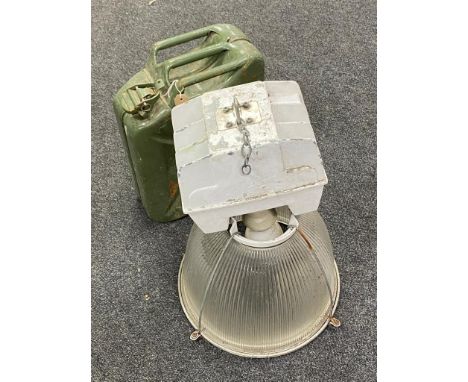 A 20l jerry can together with an industrial halogen light fitting 