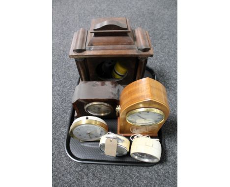 A tray of inlaid mahogany and walnut eight day mantel clock, mid century alarm clocks, Seiko clock etc 