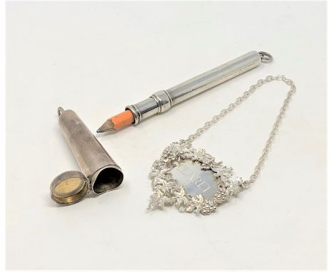 A silver pencil holder, a silver cheroot and a good quality silver Claret decanter label (3)