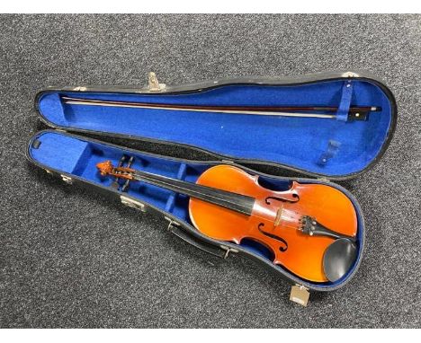 A Chinese violin and bow in hard carry case 