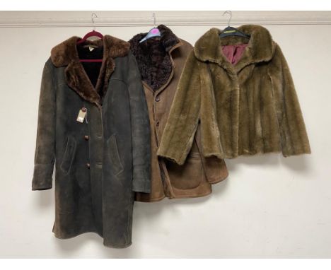 Two sheepskin jackets together with a faux fur lady's coat 