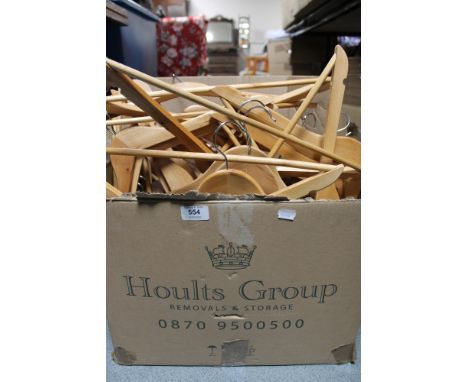 Three boxes of wooden coat hangers 