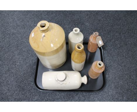 A tray of Gamble and Gilbert glazed stoneware flagon together with four further vintage bottles and stoneware hot water bottl