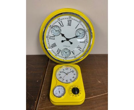 Two yellow enamel wall clocks 