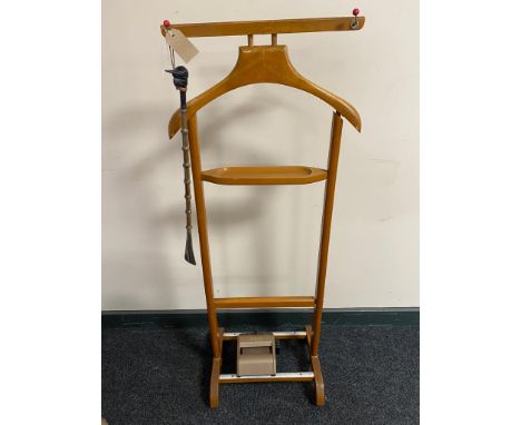A mid century valet stand together with a tie master roller and shoe horn with jockey head handle 