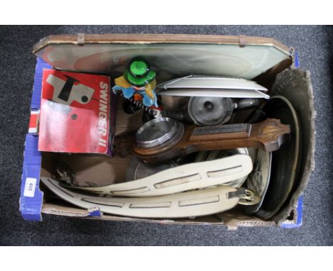 A box of monochrome portrait, silver plated tea ware, horse brasses on leather, oak barometer, Murano glass clown 