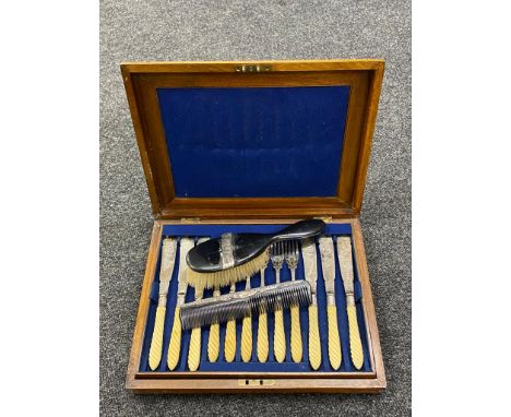 A Victorian burr walnut cased cutlery canteen of EPNS and ivorine fish cutlery, together with an ebony and silver mounted com