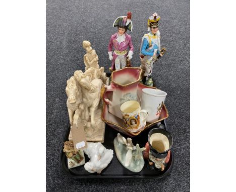 A tray of two china Napoleonic style figurines, resin figure of a soldier, two Nao ducks, tankards etc 