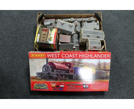 A boxed Hornby West Coast Highlander 00 gauge train set together with a further box of buildings and engine shed 