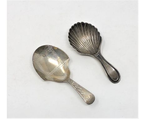 A Georgian silver caddy spoon and a Victorian example (2) CONDITION REPORT: 23.4g gross. 