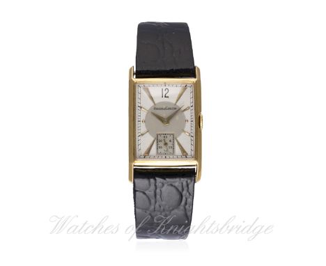 A GENTLEMAN'S 18K SOLID GOLD JAEGER LECOULTRE RECTANGULAR WRIST WATCH CIRCA 1940s D: Two tone silver dial with graduated gilt