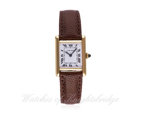 


A LADIES 18K SOLID GOLD CARTIER TANK WRIST WATCH
CIRCA 1980s
D: White dial with Roman numerals &amp; inner minute track, s