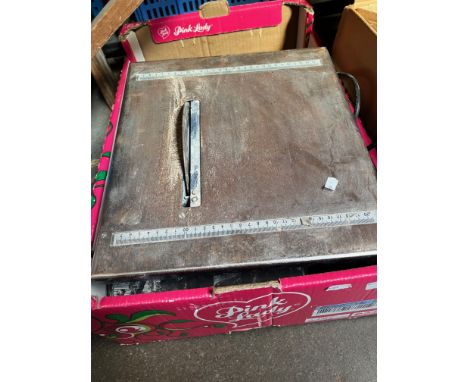 An electric tile cutter. 