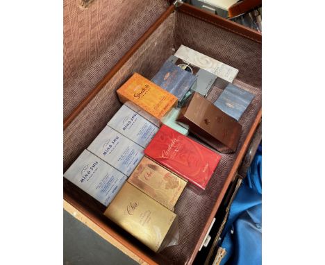 A vintage case containing assorted perfumes, mainly Yves Rocher. 