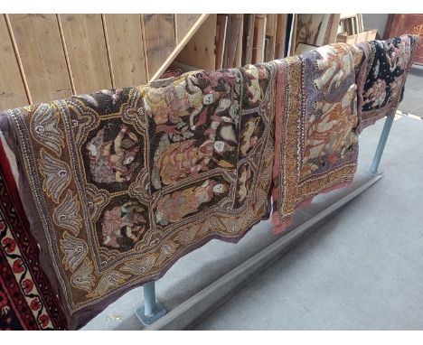 Three Eastern wall hanging textiles, decorated with beadwork figures and animals.