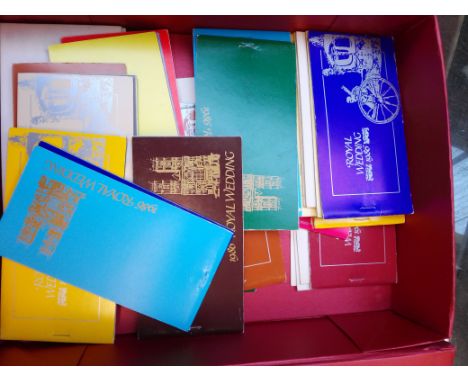 A box of commonwealth commemorative stamp booklets. 
