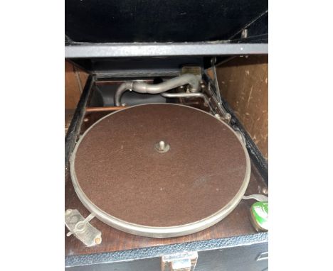 A vintage HMV record player.Dings, marks, signs of age and usage, appears all parts present including lever, stylus. Unable t