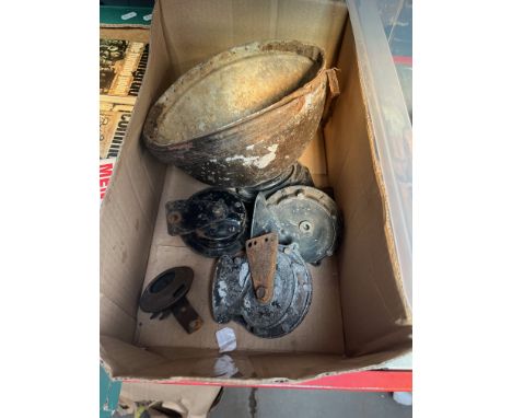 A box containing vintage car horns and helmet. 
