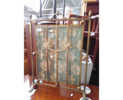 An early 20th century gilt brass and textile fire screen, height 68cm. 