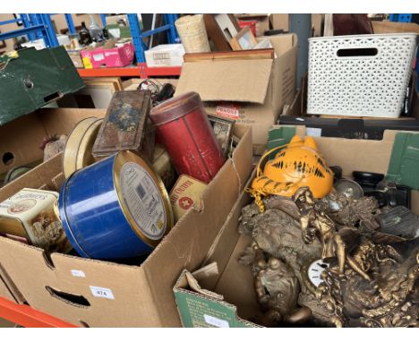 A box of vintage tins and a box containing a clock, an ebonised dressing table set, and a telephone in the form of Garfield t