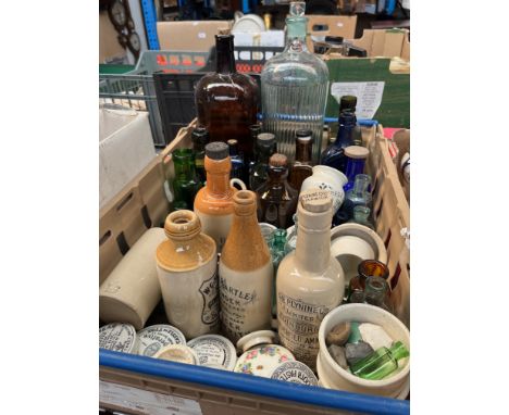 A box of vintage glass bottles &amp; pot lids