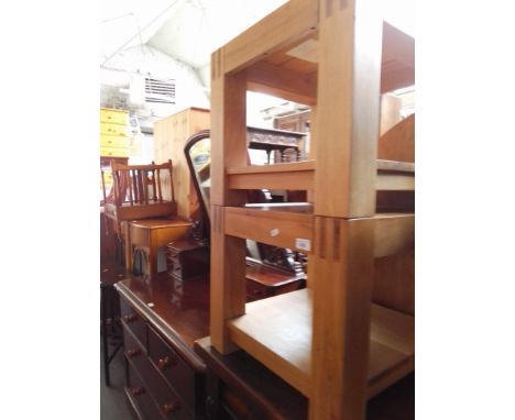 A pair of modern light wood occasional tables. 