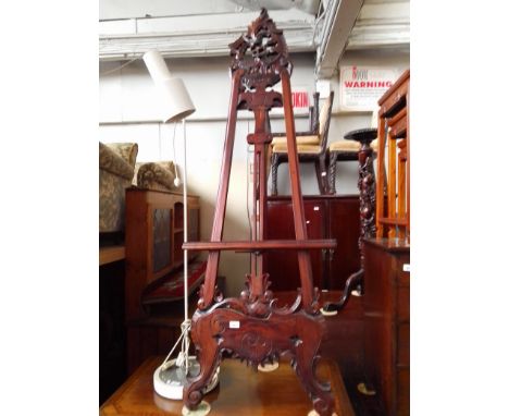 A reproduction carved mahogany easel, height 173cm. 
