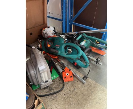 A quantity of garden tools to include a working electric chainsaw, a multi-tool gardening tool, a Bosch cordless hedge trimme