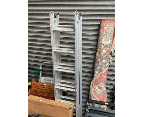 A compact triple, 2.03 metre extending ladder. 