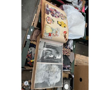 A vintage album containing various old newspapers / magazines cut-outs, etc. 