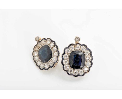 A pair of earrings, 800/1000 gold and 500/1000 platinum, set with 2 cushion cut sapphires, calibrated sapphires and 30 antiqu