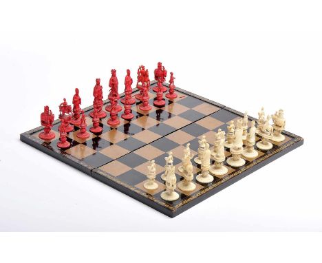 Chess pieces with case and board, carved ivory pieces "Emperor of China" and "King George II", one set dyed red, black lacque