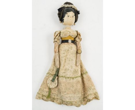 A late 19th/ early 20th century wooden 'Aunt Sally' or peg doll:,  applied woollen hair over painted head and face with earri