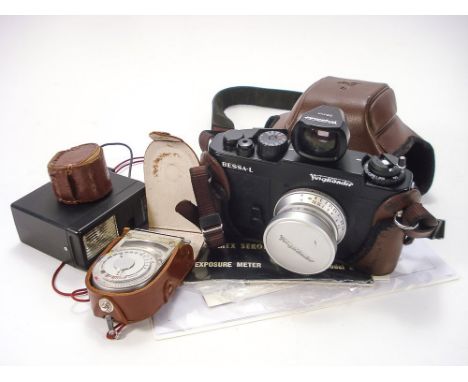 A Voitlander Bessa-L 35mm camera: with spare range finder, flash unit, light meter and film.  