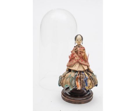A late Victorian wooden Fortune Teller peg doll:, painted hair and face over wooden body dressed in oriental style costume, t