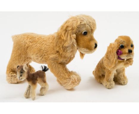 A Steiff blonde plush seated Spaniel:, together with a Steiff model of a lamb (button missing) and one other blonde plush dog