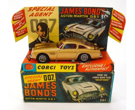 Corgi No 261 James Bond's Aston Martin D.B.5:, restored and with original instruction leaflet, lapel badge, spare passenger i