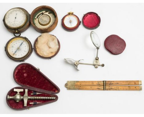 A 19th century gilt pocket barometer:, unsigned, in a leather case with compass and thermometer to interior of lid (glass a/f
