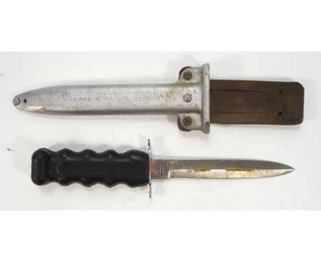 A Siebe-Heinke 'Underwater Swimming Knife':, double edge blade over plated hilt with one piece moulded rubber handle in an al