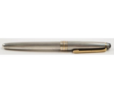 A silver Mont Blanc Meisterstuck fountain pen:, stamped 950 to cap with gilt clip and bands, signed to band as per title, eng